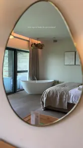 A short, aesthetic montage showcasing the facilities of a spa hotel, including the bedroom, relaxation areas, and outdoor spaces, set to calming music.
