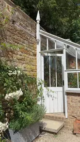 A montage of aesthetic shots featuring a historic building in the Cotswolds, including garden views, interior rooms, and countryside scenery, capturing a peaceful, rustic atmosphere.
