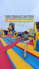 A fast-paced, engaging reel showcasing an outdoor inflatable park in Bolton, highlighting the various inflatables, slides, obstacle courses, and fairground rides available for children.