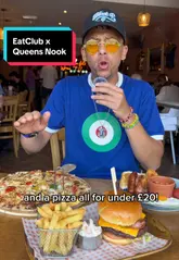 A promotional video featuring a creator interviewing the owner of The Queens Nook to explain the benefits of the EatClub discount app. The video includes close-up shots of various dishes including a full English breakfast, a cheeseburger with chips, and a pizza, while emphasizing the affordability of the menu.