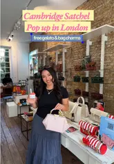A creator visits the Cambridge Satchel pop-up shop in London, which features a Badiani gelato cart, showcasing the new summer bag collection and offering free gelato and bag charms with purchases.