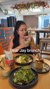 A creator visits Dear Jay in Balham, South London, to review their brunch menu. The video features close-ups of dishes like French toast, Huevos Rancheros, and short rib crumpets, alongside the creator's positive commentary on the food quality and portion sizes.