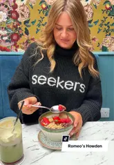 A short, engaging video review of Romeo's Cafe in Howden, featuring the creator trying out their brunch menu, including acai bowls and matcha lattes, while highlighting the cafe's stylish interior.