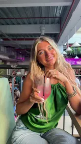 A couple visits Freight Island Newcastle, showcasing the food, drinks, photo booth, and lively atmosphere with a DJ.