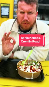 A review of Berlin Kebabs on Crumlin Road, Northern Ireland, showcasing the preparation of their signature kebabs and providing a personal recommendation.