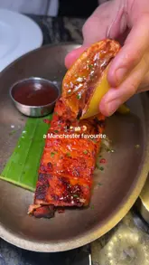 A montage video showcasing various dishes, cocktails, and the interior of Zouk restaurant in Manchester. The video uses quick cuts to highlight the food and the lively atmosphere.
