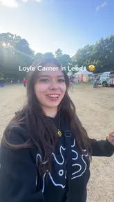 A vlog-style video capturing a live music performance by Loyle Carner at Kirkstall Abbey in Leeds. The video features clips of the artist on stage, the crowd, the venue, and incidental shots of food and drink.