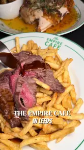 A group of friends visits The Empire Cafe in Leeds, showcasing the atmosphere, open kitchen, and several dishes including flatbread, rotisserie chicken, and steak frites.