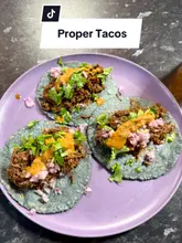 A short, energetic reel showcasing a £3 taco deal at a market stall in North London, featuring close-ups of the food and the venue's atmosphere.