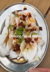 A step-by-step guide on how to steam and assemble cheung fun (Cantonese rice noodle rolls) at home, using pre-made noodles from a specialist supplier.