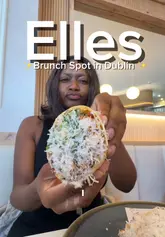 A creator visits Elle's in Dublin, providing a review of their brunch offerings including chicken caesar wraps, truffle fries, poached eggs, and matcha lattes.