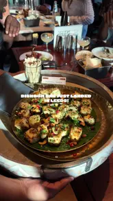 A first-look review of the new Dishoom restaurant in Leeds, showcasing the 1940s-inspired interior, signature cocktails, and a variety of Indian small plates.