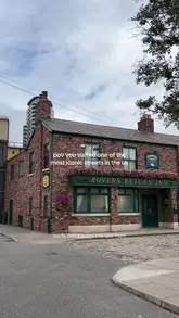 A short, energetic tour of the Coronation Street Experience at ITV Studios in Manchester, showcasing the iconic cobbled street and various set locations.