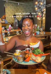 A creator visits Drake & Morgan to review their 'Reef, Beef & Bubbles' deal, showcasing the steak, lobster, and chips meal alongside drinks. The video features the venue's interior, the food presentation, and the creator's positive experience.