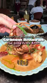 A high-quality food showcase of The Good Front Room, a Caribbean restaurant in London, featuring close-up shots of various dishes like curry goat, seafood boil, and jerk chicken.