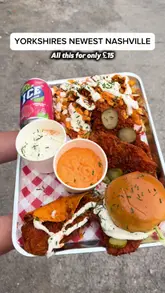 A creator reviews a £15 munch box from Bird Haus, located in a food court in Bradford, Yorkshire. The video features close-ups of a Nashville hot chicken burger, taco, tenders, and loaded fries with mac and cheese, with the creator providing commentary on the taste and texture.
