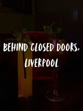 A short, atmospheric tour of 'Behind Closed Doors' in Liverpool, showcasing its dark, theatrical, and risqué interior design, vintage props like telephones, and cocktail menu.