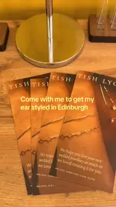 A personal vlog documenting an ear styling session at Tish Lyon in St James Quarter, Edinburgh, highlighting the studio's piercing services and welded jewellery offerings.