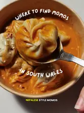 A review of MomoPlus, a street food stall located in Newport Market, South Wales, specialising in Nepalese-style momos. The video showcases various dumpling preparations, including steamed and fried options, alongside sides like tornado potatoes and lassis, while highlighting the market setting and halal-friendly menu.