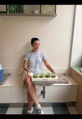 A short, handheld video showcasing a matcha tasting flight at a cafe in Leeds, featuring four different matcha-based drinks on a wooden tray.