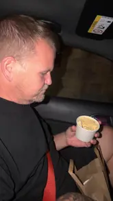 A casual, handheld vlog-style video featuring two people in a car reviewing matcha drinks and a banana pudding dessert from Mr Matcha in Sheffield. The video focuses on their taste test reactions rather than the venue itself.