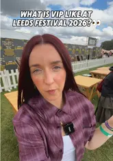 A creator provides a tour of the VIP area at Leeds Festival, highlighting the facilities such as the toilets, seating areas, and the view of the main stage.