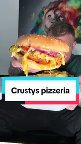 A creator reviews a takeaway meal from Crusty's Pizzeria in Darlington, sampling a munch box, a burger, and a tandoori chicken pizza.